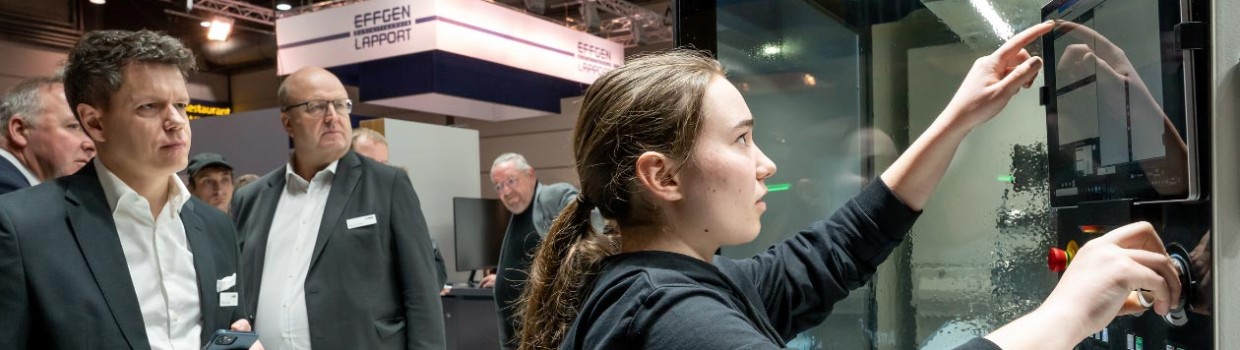 people watching a person showing something on a screen people watching a person showing something on a screen